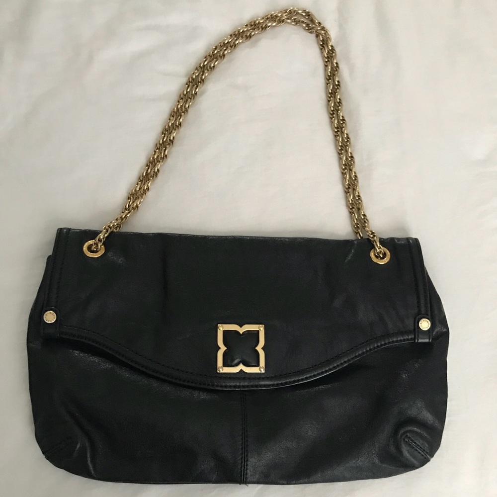 BCBG black leather clutch with gold hardware.